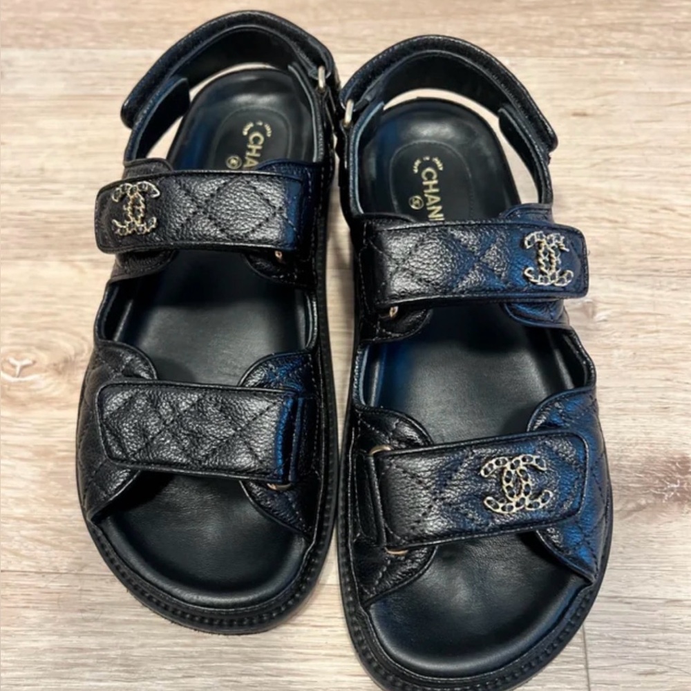 CHANEL Black Leather Sandals with Gold Accents
